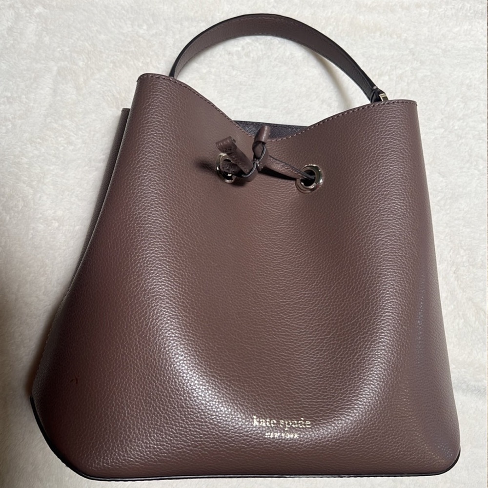 Rarely used Kate Spade Bucket Bag
Comp photo at the end